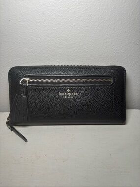 kate spade black pebbled leather zip-around wallet with tassel